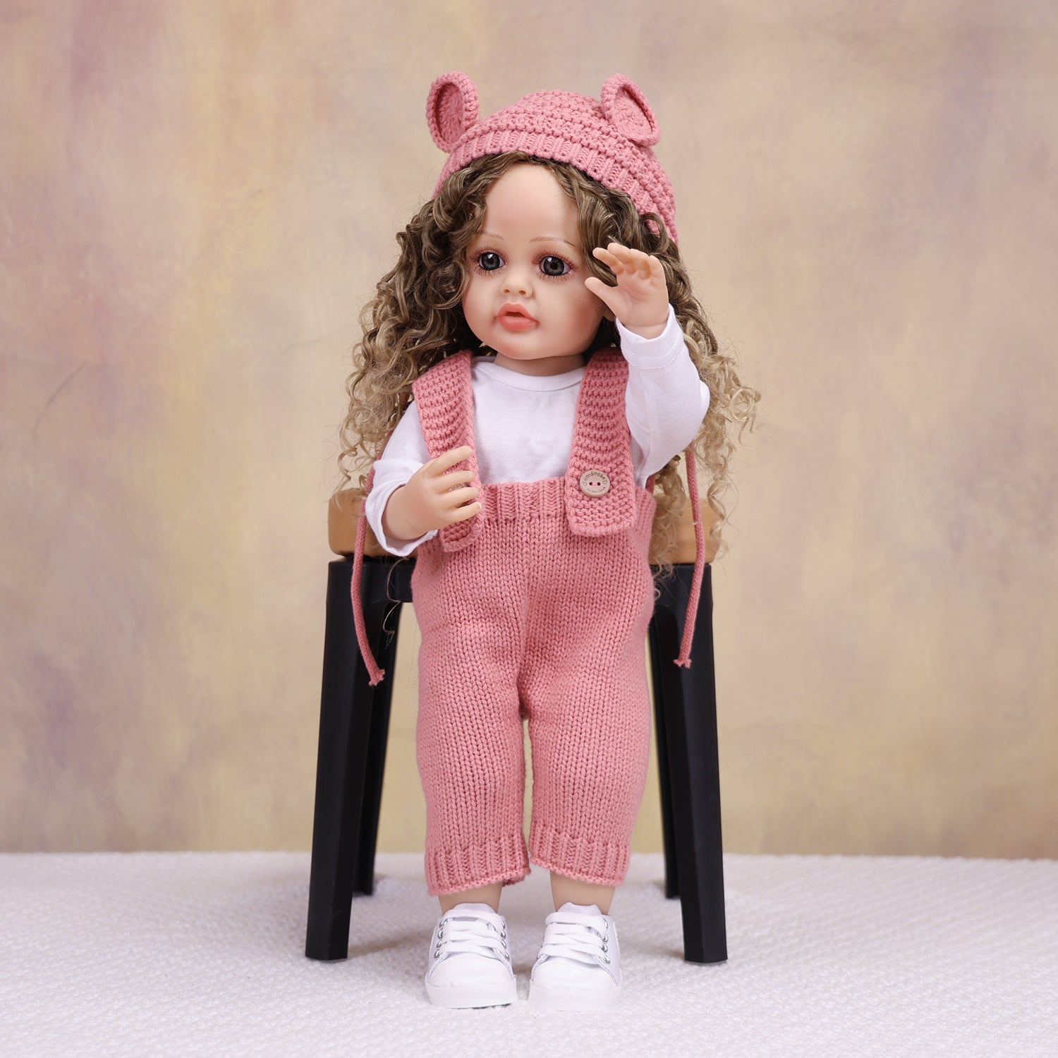 Sweetpea reborn toddler doll in cozy pink knitted outfit
