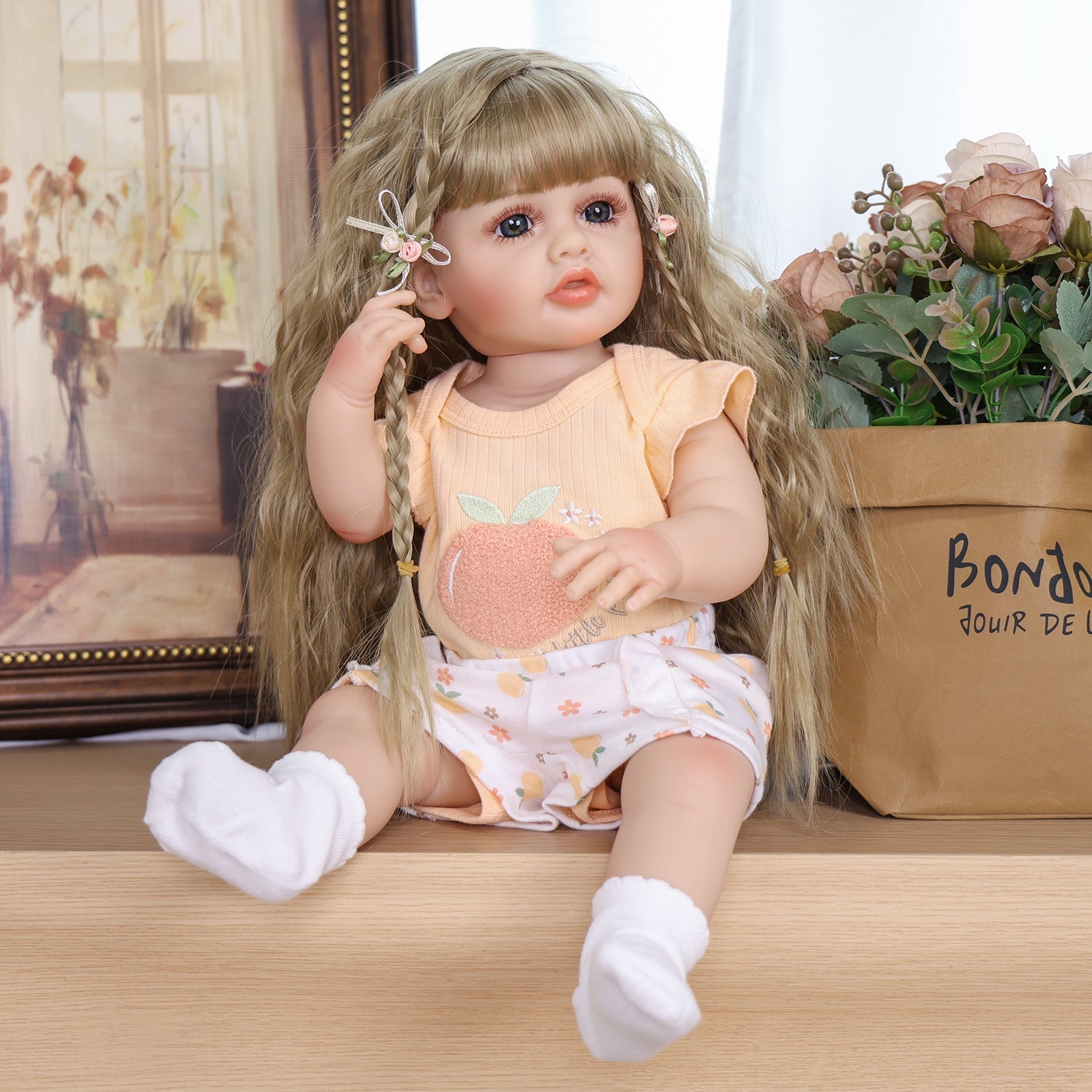 KEIUMI Peaches reborn toddler doll sitting, smiling