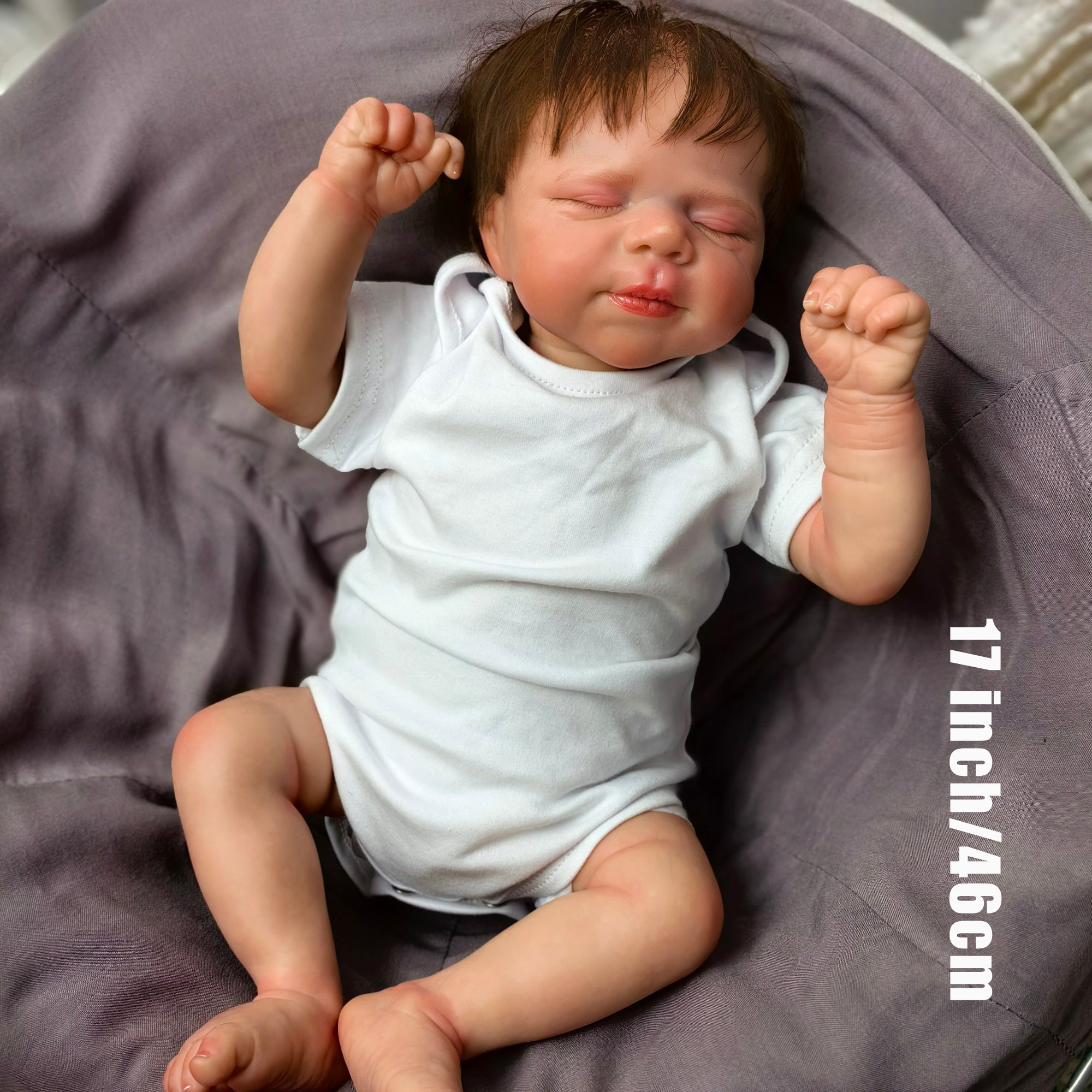 Adorable KEIUMI reborn doll sleeping peacefully, showing delicate facial features.