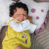 Full body view of the KEIUMI sleeping reborn doll on a soft blanket.