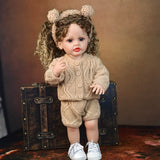 KEIUMI Clover reborn doll in profile, highlighting curly hair and headband.