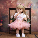 Reborn doll's blonde hair and pink glitter cat ear headband with silver crown.