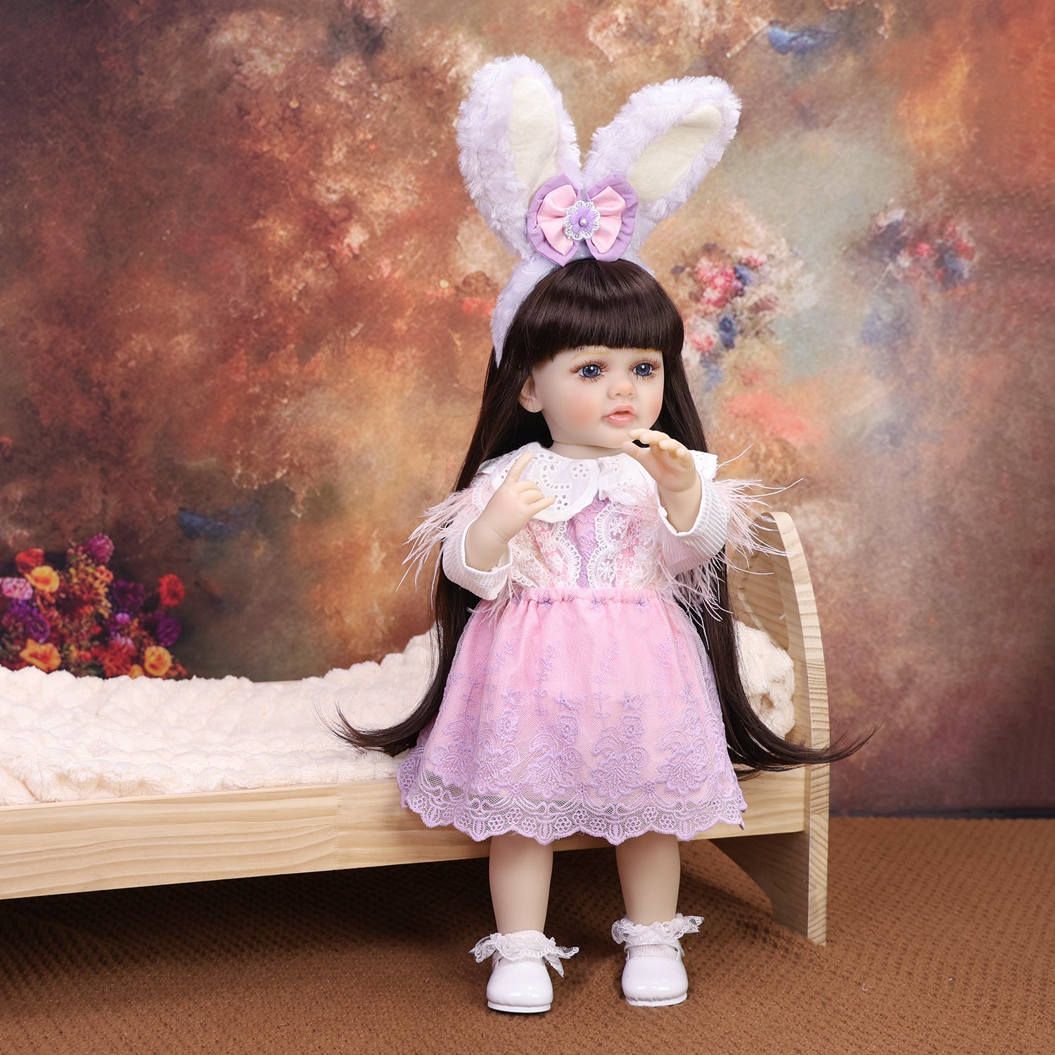 Close-up of KEIUMI Primrose doll's sweet face and blue eyes.