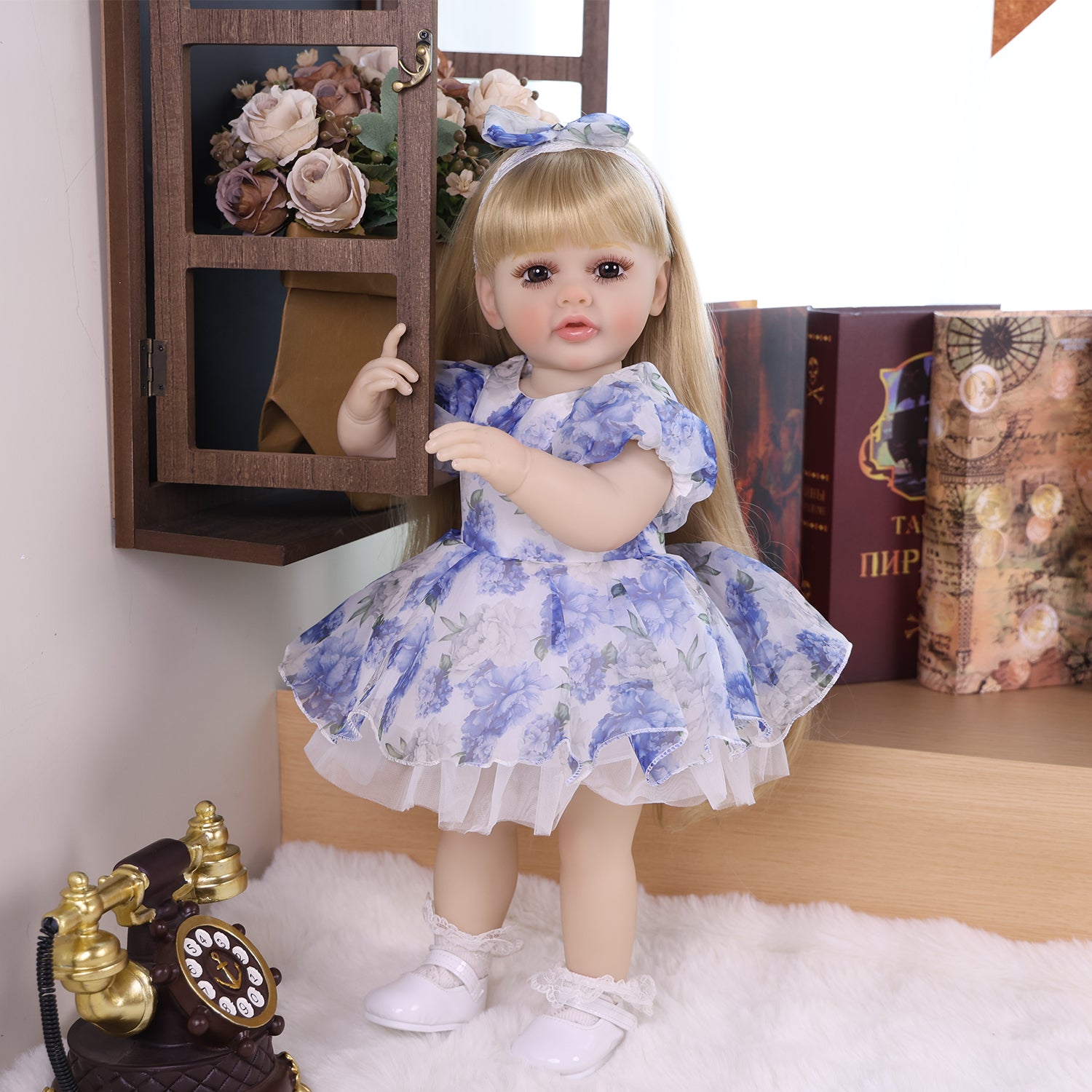 KEIUMI Cherish vinyl reborn doll wearing a soft baby outfit.