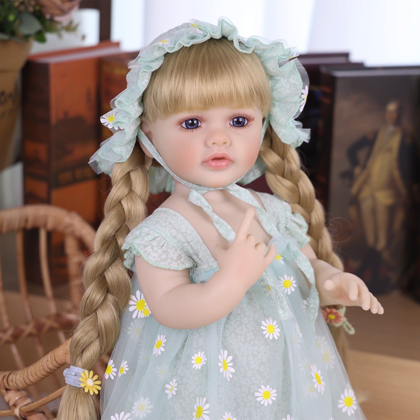 Daisy Bloom reborn doll from above, displaying her full outfit and details.