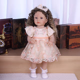 Side profile of Emmeline reborn doll, highlighting her curly hair and pensive expression.