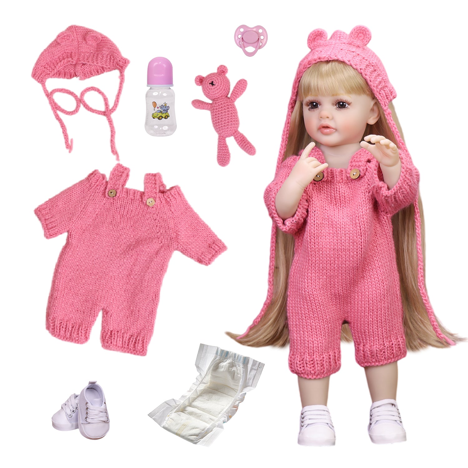 Close-up of Maisie reborn doll's hand holding a pink knitted bear toy.