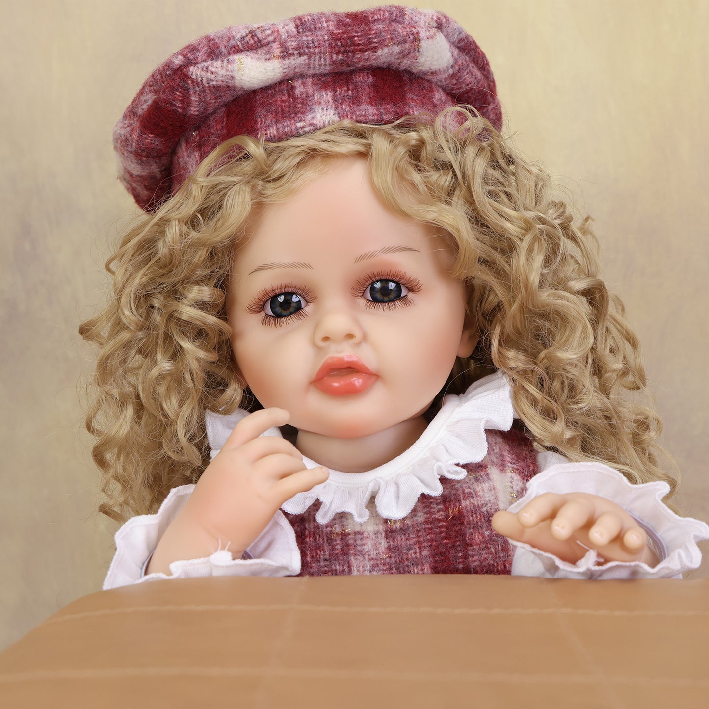 KEIUMI Curious Belle reborn doll with her full ensemble and accessories.