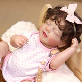 Close-up of Rosalie's feet with white socks and pink ruffled cuffs.