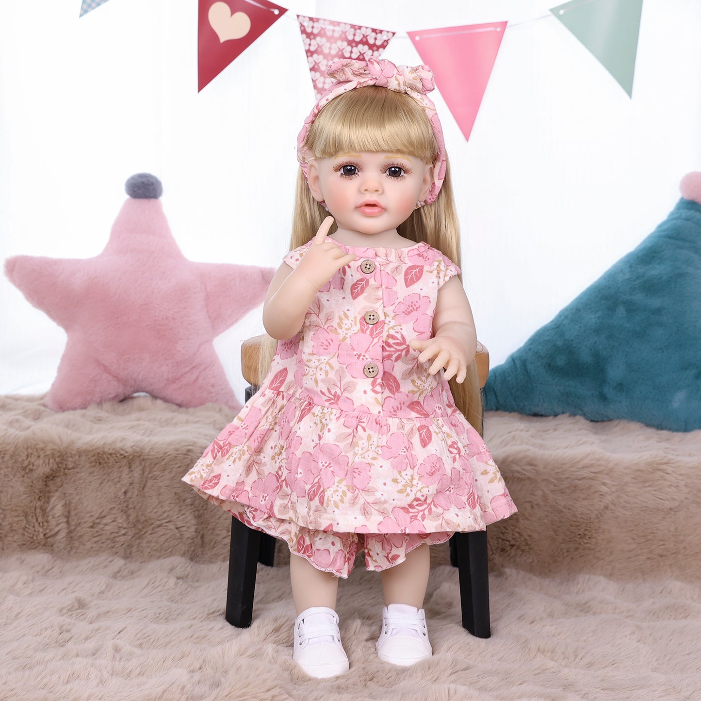 KEIUMI Posy reborn doll's innocent expression and delicate features.