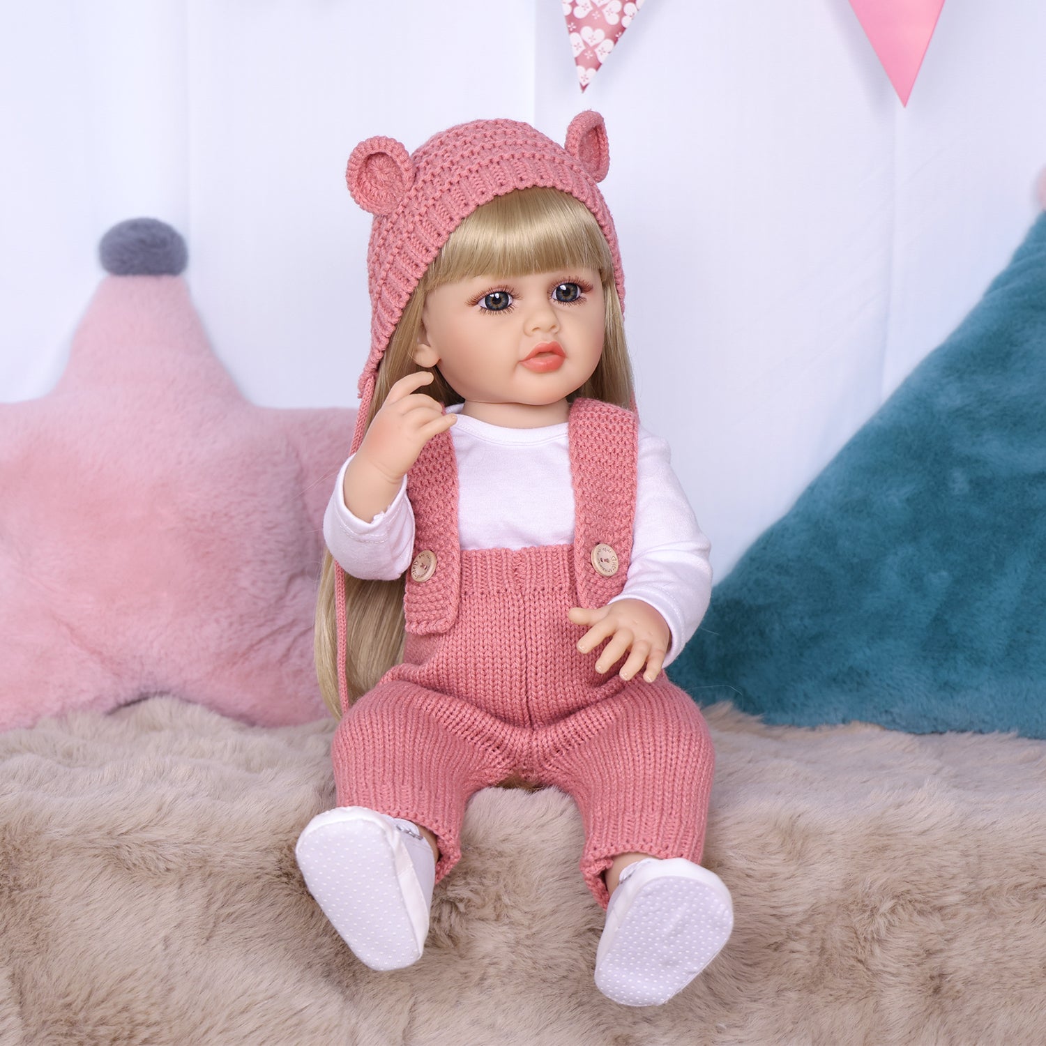 KEIUMI Blossom doll's hands and feet with white booties and grip dots.