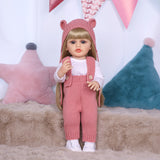 Side profile of Blossom reborn doll, highlighting her blonde hair and knitted hat.
