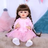 Close-up of Lily reborn doll's face, showing pouty lips and dark brown hair.
