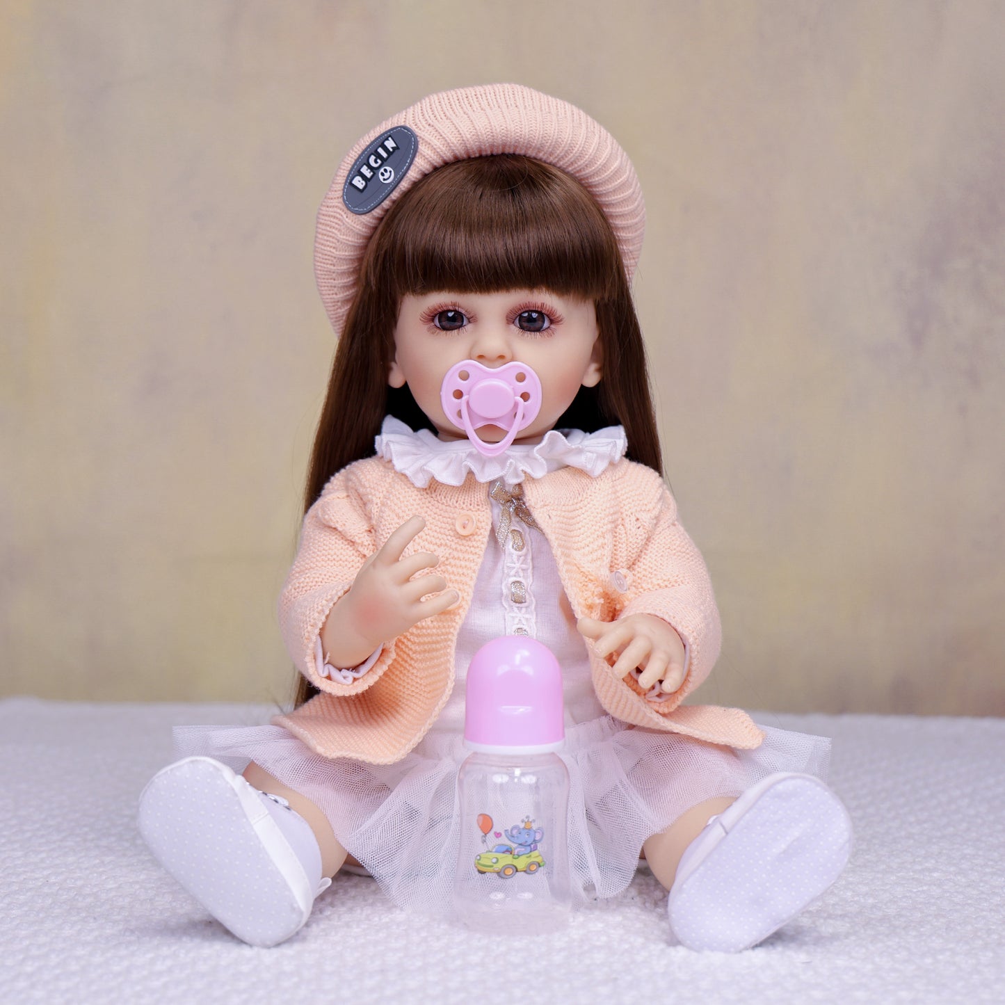 KEIUMI Cora 22" Vinyl Reborn Toddler Doll, Peach Cardigan Outfit