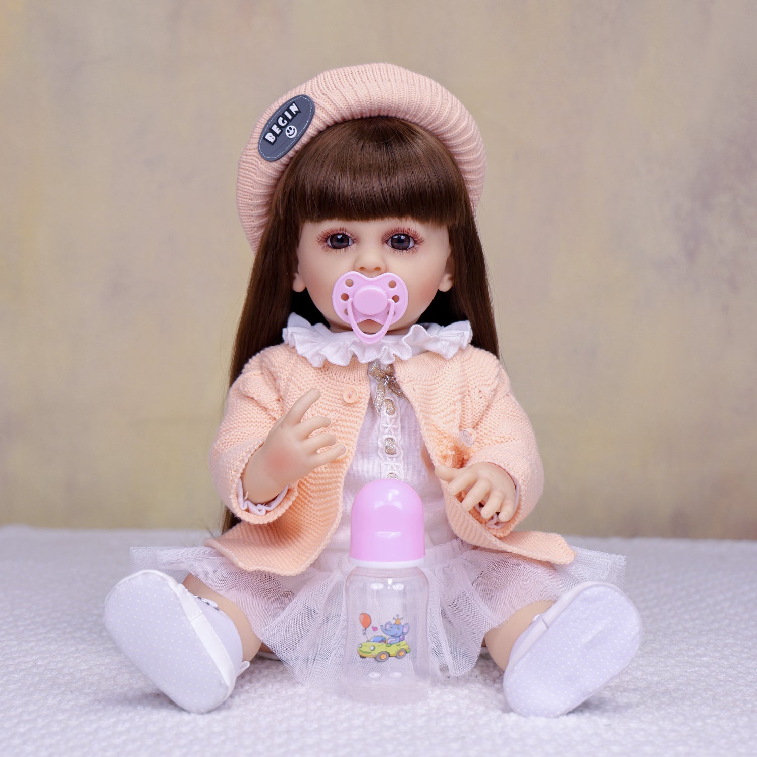 KEIUMI Cora 22" Vinyl Reborn Toddler Doll, Peach Cardigan Outfit