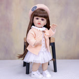 KEIUMI Cora 22" Vinyl Reborn Toddler Doll, Peach Cardigan Outfit