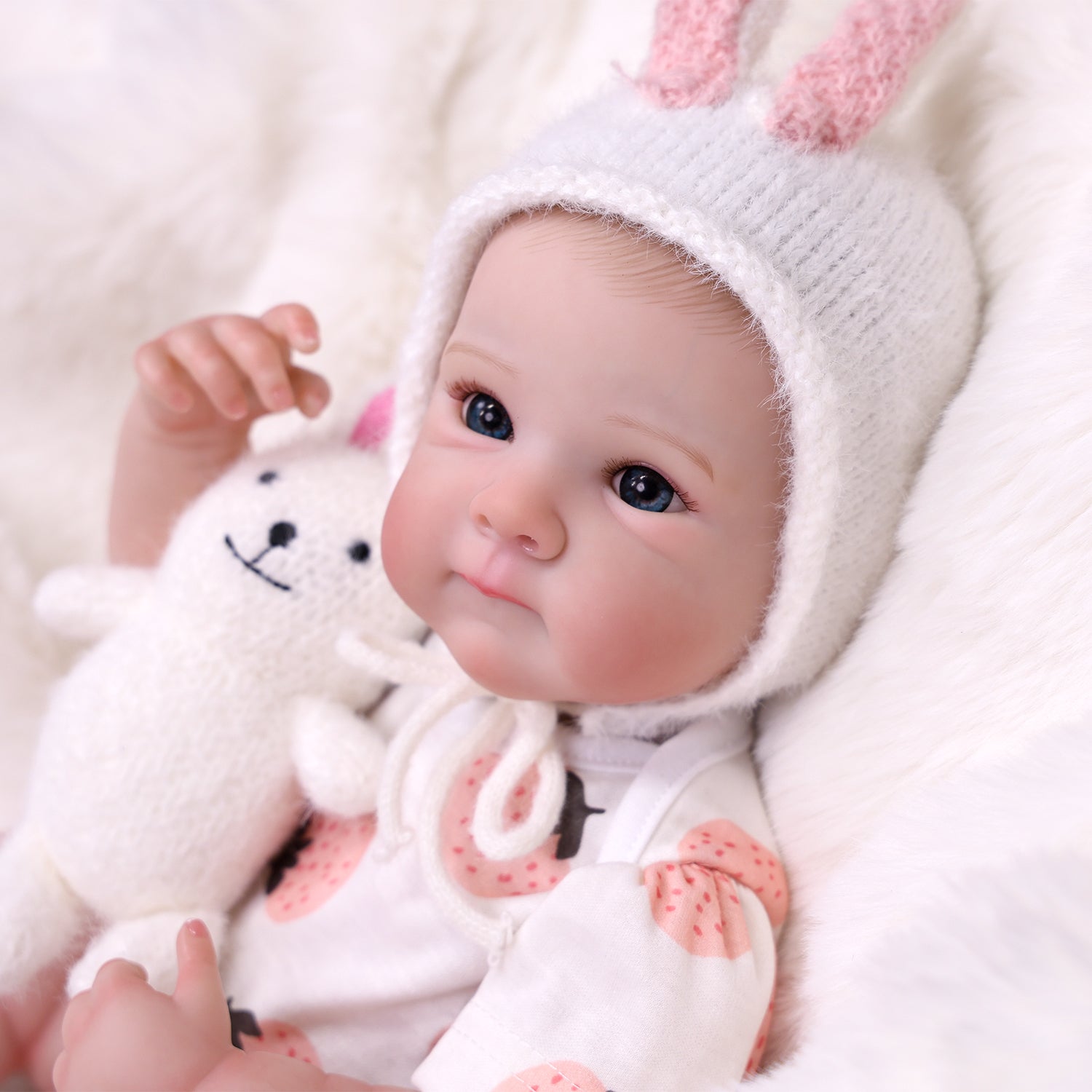 Full length shot of reborn doll with pacifier and bottle.