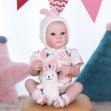 Close-up of reborn doll's expressive blue eyes.