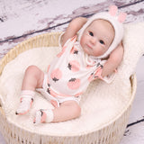 Reborn doll's foot with detailed toes and skin folds.