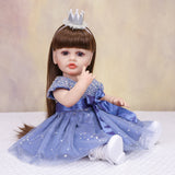 Side profile of Aurora reborn doll showing her long brown hair and blue gown.