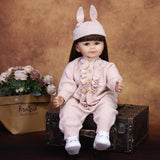 Side profile of Poppy reborn doll, highlighting her long dark brown hair.