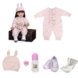 Poppy reborn doll lying down, showing her white sneakers with 'BABY' text.