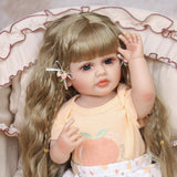 Close-up of Peaches reborn doll's face, showing neutral expression and blue eyes.