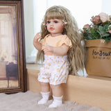 Full view of KEIUMI Peaches doll in peach-themed onesie and white shorts.