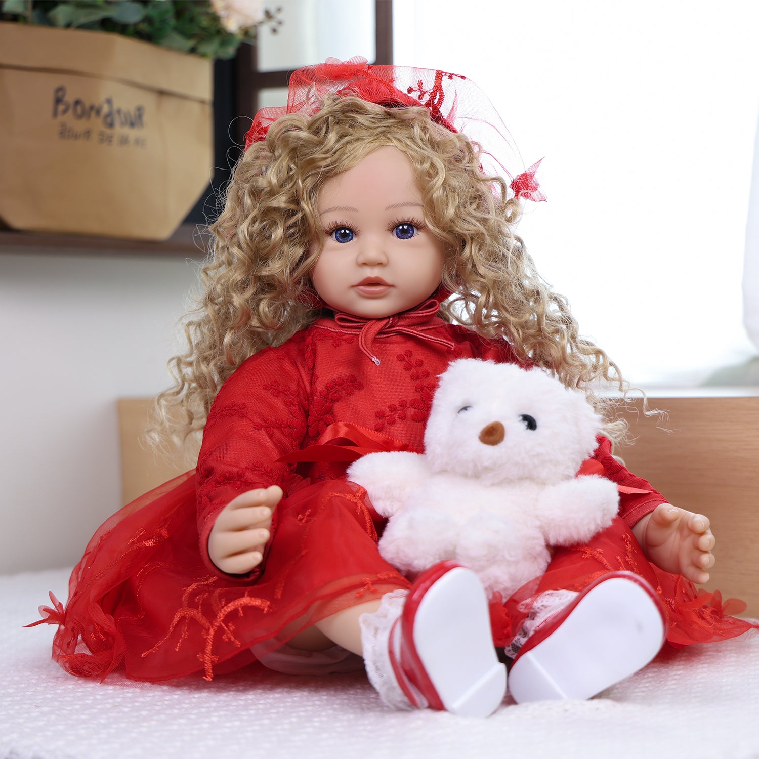 Ruby Belle doll's feet in red and white Mary Jane shoes with lace-trimmed socks.