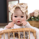 KEIUMI Winnie Newborn Soft Touch Vinyl Reborn Baby Doll, Wide Curious Eyes, Charming Floral Outfit