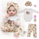 KEIUMI Winnie Newborn Soft Touch Vinyl Reborn Baby Doll, Wide Curious Eyes, Charming Floral Outfit